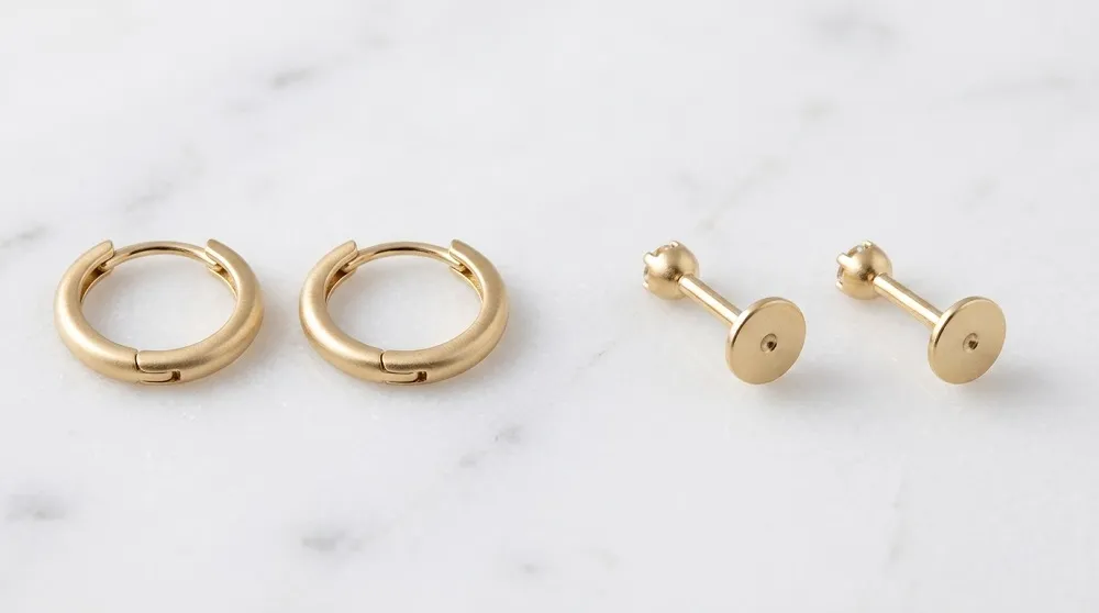 Sleeper earrings and flat-back labret stud earrings in gold designed for safe overnight wear during sleep 