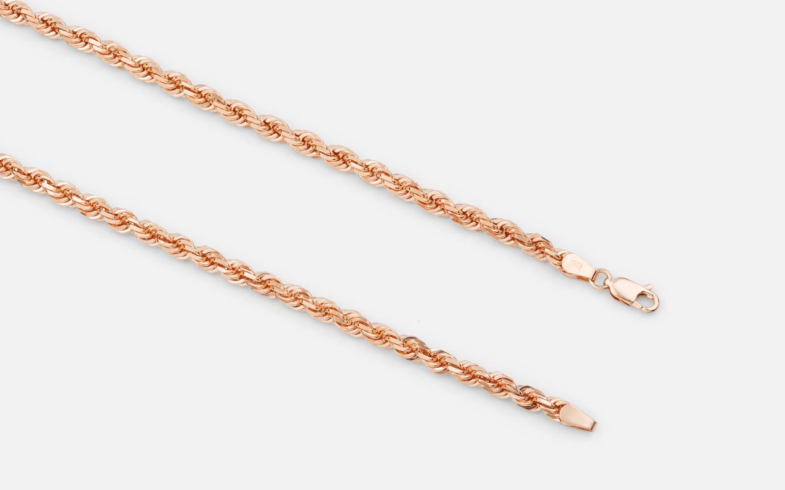Close up of gold chains in different link styles