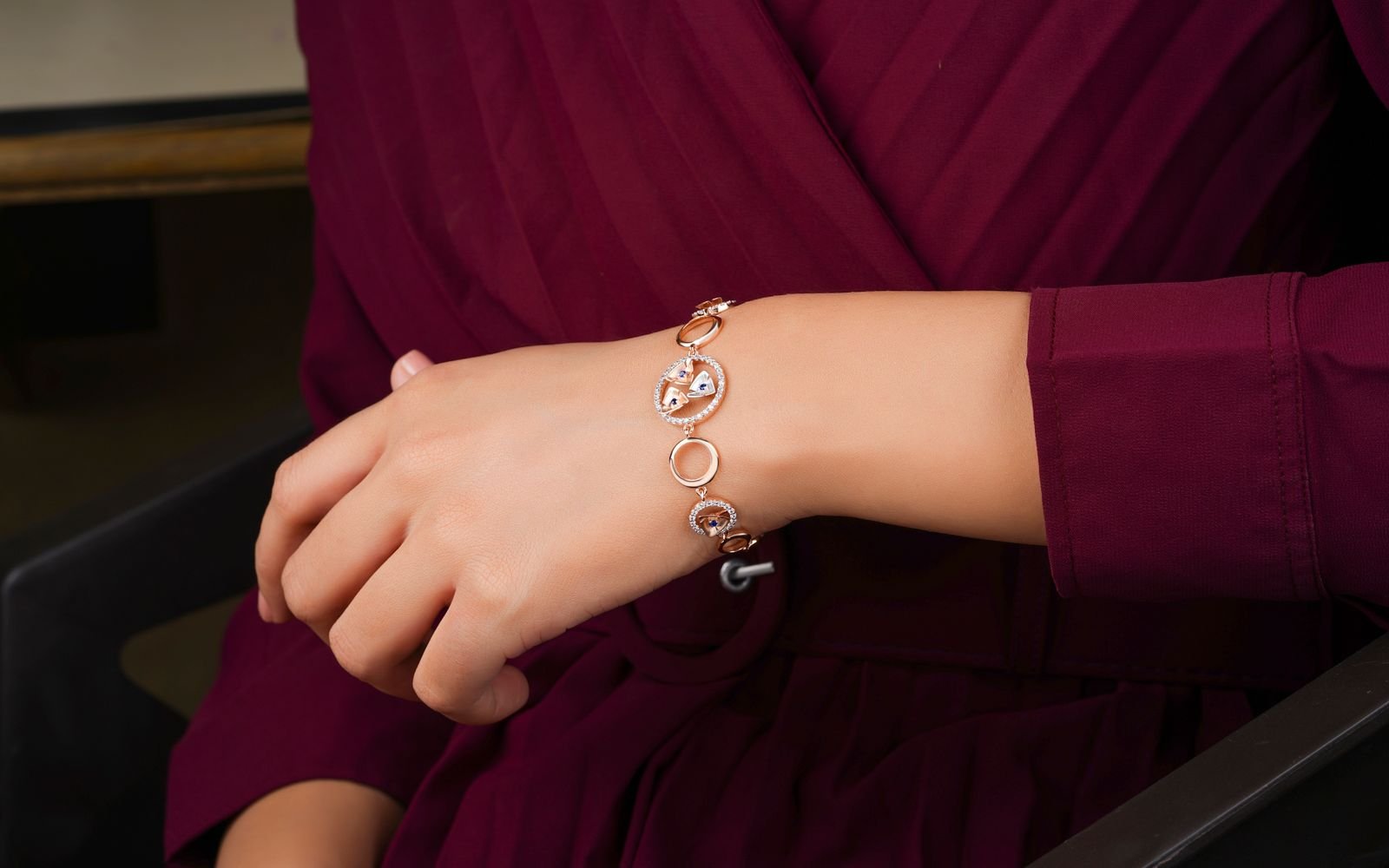 Close up of a gold bracelet on wrist